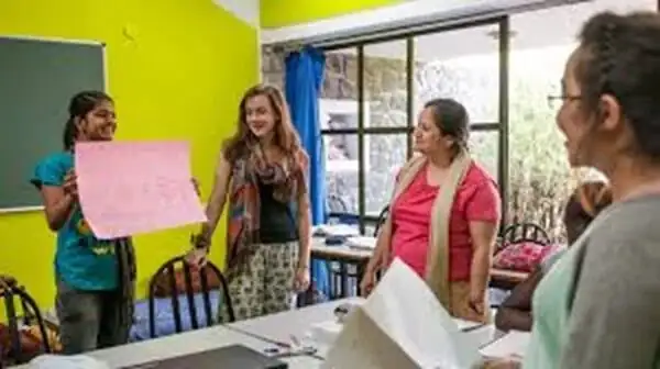 Students and a facilitator in a bright classroom session
