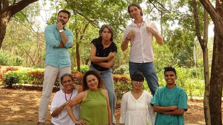 MUWCI counsellors and wellbeing staff standing together among the campus trees